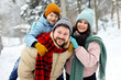 © New Africa - Happy family spending time together outdoors on winter day