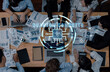 © InfiniteFlow - A collaborative business meeting in a modern workspace, showcasing professionals analyzing data, with laptops and digital graphics enhancing productivity and teamwork. Trope