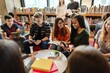 © Rawpixel.com - Diverse group of young adults studying in a library. Students reading books, discussing, and collaborating. Engaged in learning, sharing ideas, and teamwork. Diverse people in library.