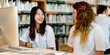 © Rawpixel.com - Diverse students of Asian and Caucasian women studying together, using computer in a library. Students collaborating using technology. Diverse students in library setting. High school education.