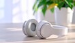 © Saepul - Minimalist White Wireless Headphones on White Wooden Table