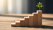 © AlqausarBonazir - Green plant grows on wooden block stairs symbolizing sustainable business growth and career progress