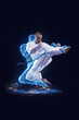 © Lustre Art Group  - Martial artist performing powerful kick with digital energy silhouette. Concept of combat training, body control, performance analysis, self improvement programs and futuristic sports visualization.