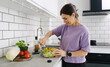 © Ievgen Skrypko - Woman Mixing A Vegetable Salad For Dinner