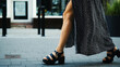 © Ievgen Skrypko - Stylish Young Woman In Dress With Naked Legs And High-Heeled Shoes Walking The Street