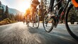 © rabbit75_fot - Cardio sports cycling biking exercise training, healthy lifestyle. A group of cyclists riding down a road at sunset, with the sun casting a golden hue over the landscape. The cyclists are in motion.