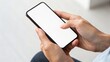 © thanawat - Person holding a smartphone with a blank screen, showcasing modern technology and mobile communication.