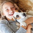 © Tatyana Gladskih - Close up Portrait of smiling child Girl plays with her Dog at home, looking at camera