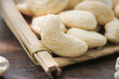© MinhChau - Fresh White Cashew Nuts on Wooden Board - Daily Snack