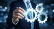© lianlian liang - Businessman hand touching glowing gear icons. Concept of teamwork, business process management, and industrial integration. Synergy, mechanical engineering, system settings, and strategic development
