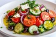 © dashtik - Vibrant greek salad with fresh vegetables, feta, and olives on a plate