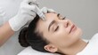 © 69 - Relaxed woman receiving a facial treatment on a beauty bed, enjoying a serene moment while lying down with closed eyes