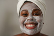 © Sabrina - Young african woman applying face mask - Natural skin care routine - Cleaning face with natural cosmetics