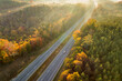 © bilanol - Elevated view of freeway road lanes between autumn mountain hills. Interstate transportation infrastructure in USA