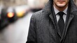 © kvladimirv - Stylish Businessman in Gray Tweed Coat and Black Tie on Urban Street