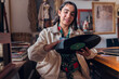 © Stock Latino - Latina woman cleaning vinyl record at home