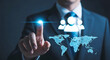 © Mobasser - A businessman in a suit interacting with a digital global network interface