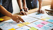 © FATIHAKHANDOKER - A close-up shot captures business professionals collaborating on a new project design and strategy
