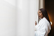© ADDICTIVE STOCK - Woman enjoying peaceful hotel view