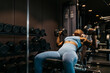 © ADDICTIVE STOCK - Woman exercising in a hotel's modern fitness center