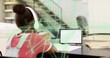© vectorfusionart - Studying girl in white headphones and red tee at study table focusing on tablet, AR graphics