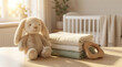 © OlgaKon - Soft stuffed bunny next to folded towels in bright nursery setting