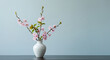© Martin - Fleurs de cerisier roses d�licates dans un vase blanc simple une lumi�re naturelle douce baigne la sc�ne printani�re. AI Generated
