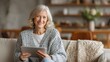 © marco - Senior woman using tablet