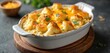 © Vadym - Creamy cauliflower and cheese bake in dish. Golden bechamel sauce melts over florets. Home cooked dish with melted cheese topping. Delicious comfort meal.