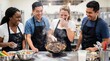 © peacefy - An amusing scene unfolds in a professional kitchen as a group of chefs react with a mix of surprise and laughter to a cooking mishap.