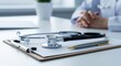 © MstRahima - Doctor's desk with stethoscope, pen, and clipboard ready for patient consultation