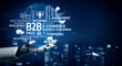 © InfiniteFlow - This image features a robotic hand illustrating the concepts of B2B strategies, e-commerce solutions, and networking against a futuristic blue digital backdrop. Tessel