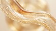 © Jonathan Gasley - Close up abstract view of shimmering golden liquid with suspended particles and air bubbles in a smooth wave formation macro shiny glitter texture flow energy cosmetic serum