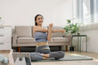 © NINENII - Asian healthy woman workout at home, exercise, fit, doing yoga, home fitness concept.