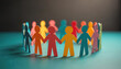 © Viktor - Colorful paper people hold hands forming circle. Diverse figures stand together showing unity, teamwork, and community spirit. Group connection symbolizes inclusion, togetherness, and support for all.