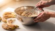 © Andrey - Woman hands mixing banana bread batter in metal bowl with whisk. Baking preparation and homemade dessert recipe concept for food blog.