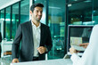 © DG PhotoStock - Businessman Checking In at Airline Counter and Receiving Boarding Pass