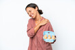 © luismolinero - Young hispanic woman holding eggs isolated on white background suffering from pain in shoulder for having made an effort