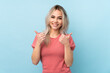 © luismolinero - Teenager girl over isolated blue background with thumbs up gesture and smiling