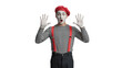 © Afroja - Mime with red beret and striped shirt in white gloves posing on transparent backdrop