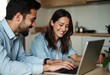 © LucieAliceNova - Young Couple Collaborating on a Laptop in a Modern Kitchen, Sharing Laughter and Ideas