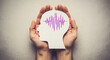 © creative - Adult and child hands holding encephalography brain paper cutout, Epilepsy awareness, seizure disorder, mental health concept
