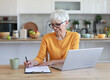 © Lumos sp - Portrait of a mature senior woman a businesswoman working from home having a meeting online, home office, or a student learning, or mature woman surfing net shopping or reading