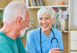 © Lumos sp - Portrait of a senior doctor or nurse caregiver talking consultation with senior man at home or nursing home