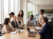 © Abdallah - Diverse Business Team Collaborating in Modern Office Meeting