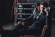 © ArtSys - Portrait of a handsome young stylish sexy man in a white shirt, , suit, jacket posing in studio with a loft interior. Black and white. Casual clothes, modern style. Male groom wedding photoshoot