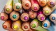 © mila103 - Colorful array of sharpened colored pencils in a circular arrangement.