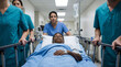 © Eduardo Accorinti - Hospital team transporting pediatric patient on stretcher in emergency care corridor. Medical staff teamwork, pediatric healthcare and hospital support concept