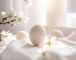 © Kitta Studio - White Egg Surrounded by Blossoms on Soft Fabric Background