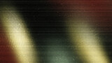 Abstract metallic background texture featuring smooth horizontal lines with a mix of dark, gold, and red color gradations with light glitch and film grain effects